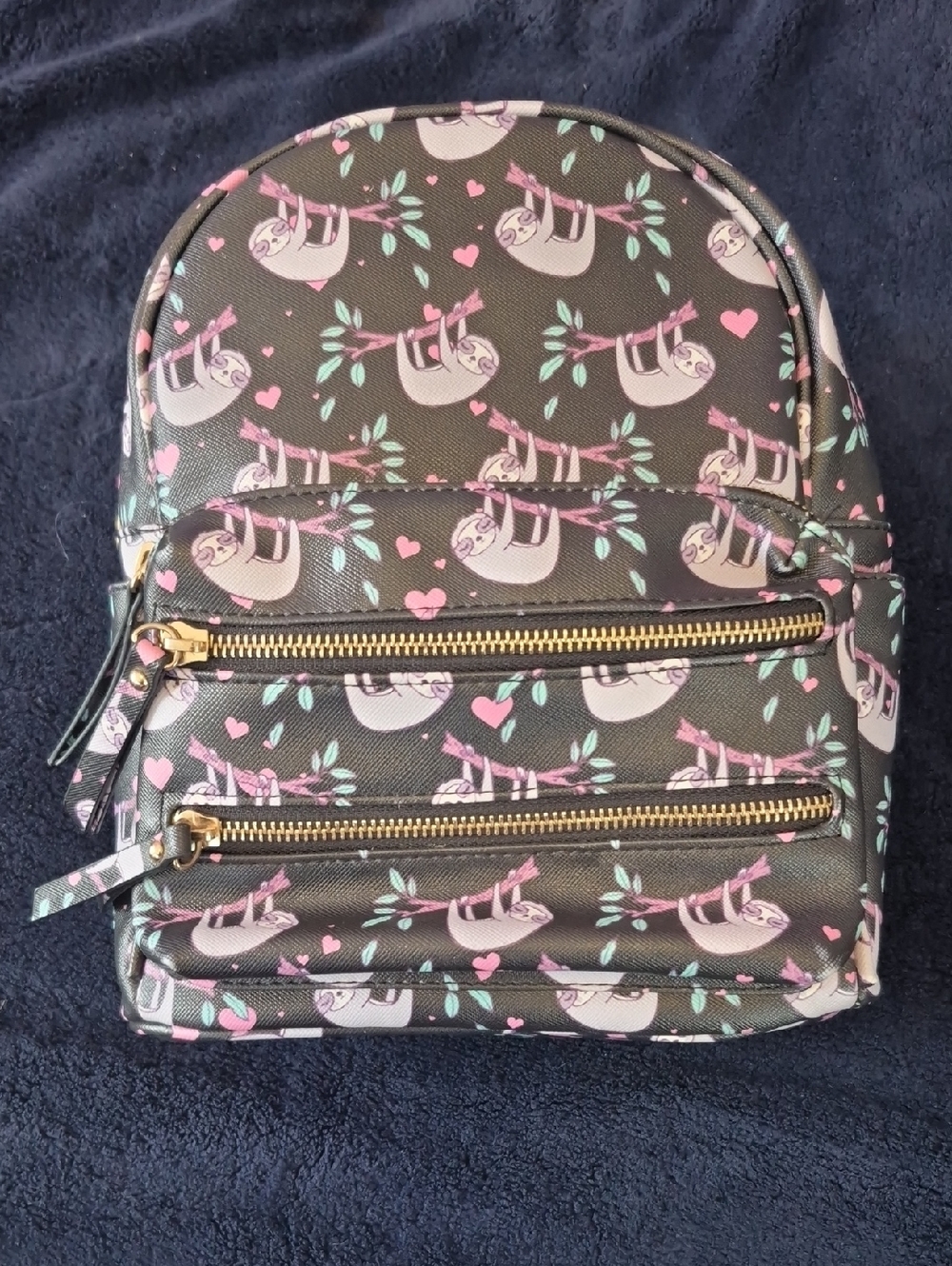 Under One Sky Black Backpack with Gold Logo